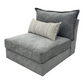 Sunset Sectionals Kent modular armless chair in grey textured fabric with a striped lumbar pillow in a showroom