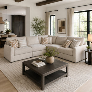 Sunset Sectionals 5-piece modular sectional in cream fabric with deep seating and matching patterned throw pillows.