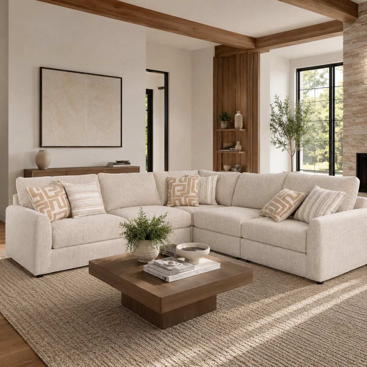 Sunset Sectionals 5-piece modular sectional in cream fabric with deep seating, accent pillows, and solid wood frame.