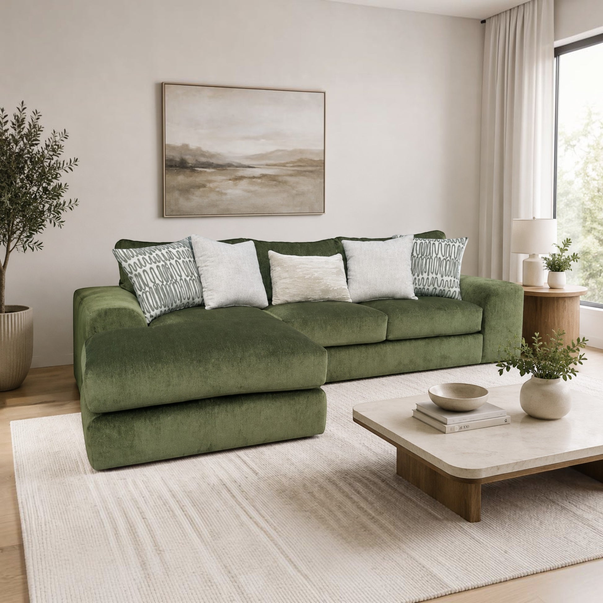 Sunset Sectionals Ivy sofa chaise sectional in soft green fabric with deep seating and decorative throw pillows.
