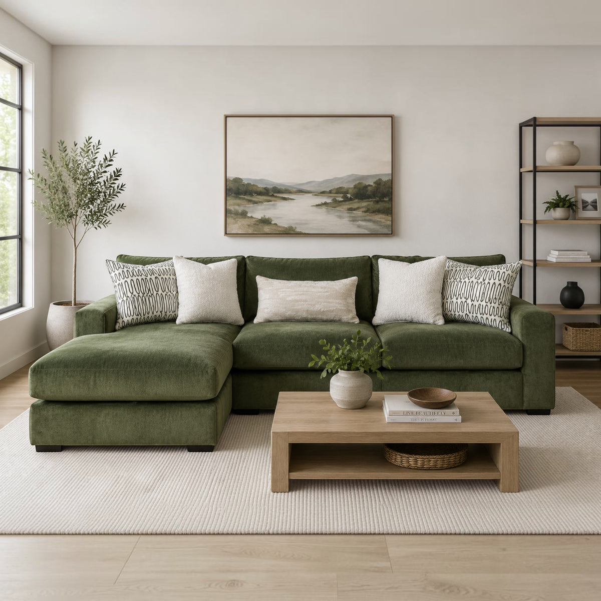 Sunset Sectionals Ivy green fabric chaise sectional sofa with reversible cushions in a cozy, modern living room.