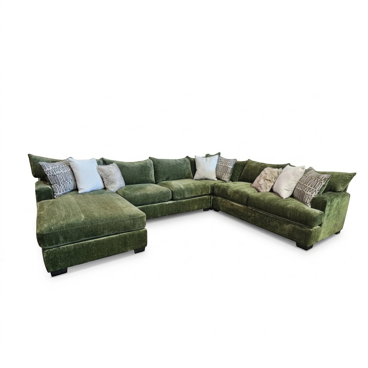 Sunset Sectionals Ivy U-shape sectional in green fabric with deep seating, reversible cushions, and decorative pillows.