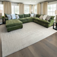 Sunset Sectionals Ivy oversized green U-shaped sectional with reversible cushions in a bright, modern living room.