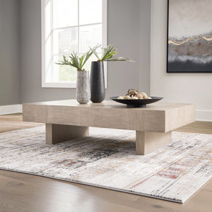 Sunset Sectionals Jorlaina rectangular cocktail table in light gray wire-brushed oak veneer with a double plinth base.
