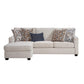 Sunset Sectionals Michigan reversible sofa chaise in light beige fabric with patterned throw pillows