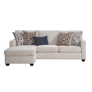 Sunset Sectionals Michigan reversible sofa chaise in light beige fabric with patterned throw pillows